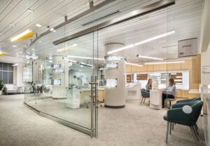 One of two entrances to the Optical Retail Area, with minimal framing and sliding glass doors for an open, welcoming feel.
